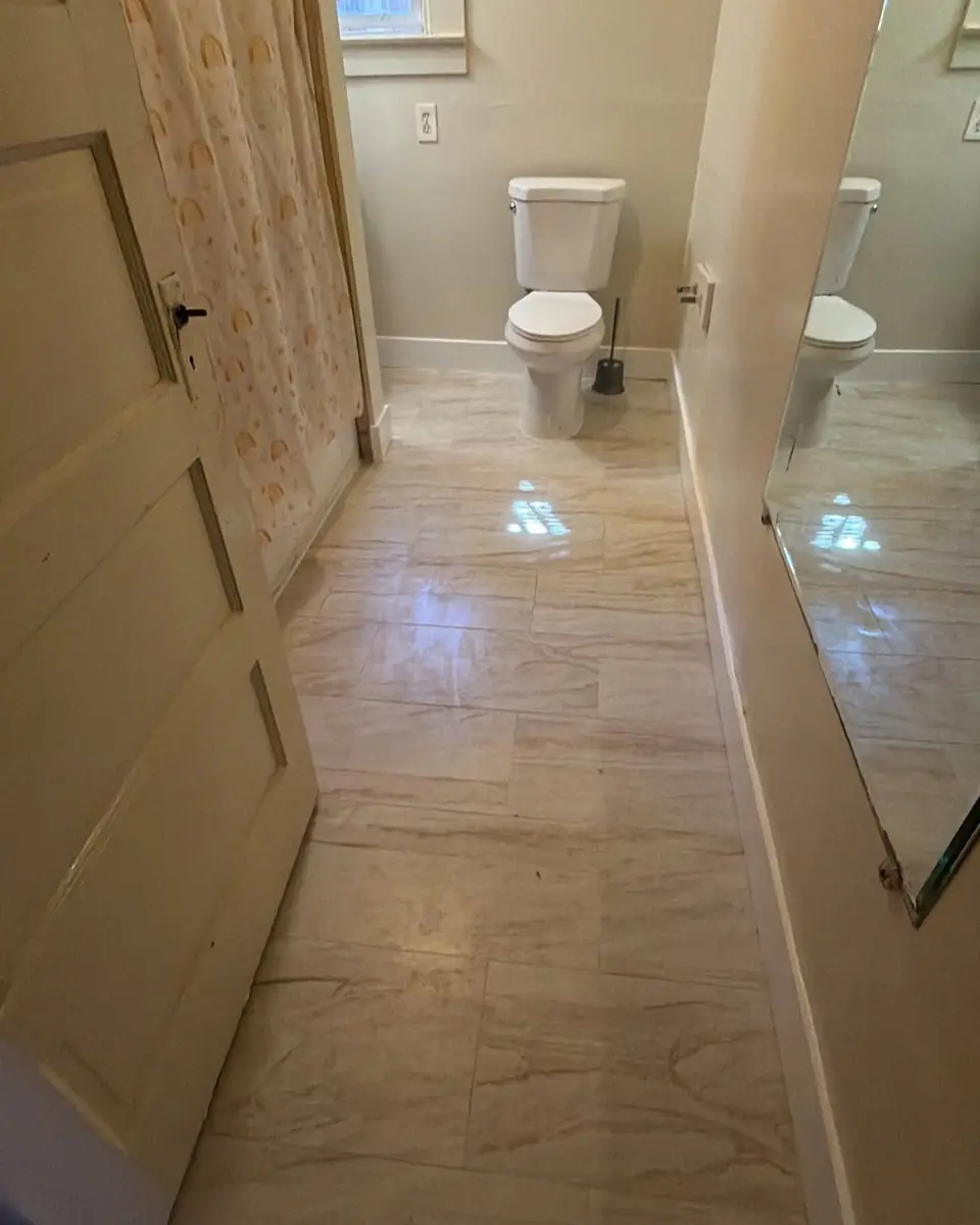 Bathroom floor rebuilt with new subfloor around the toilet opening