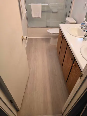 Bathroom Flooring & Baseboard Replacement and toilet replacement — completed