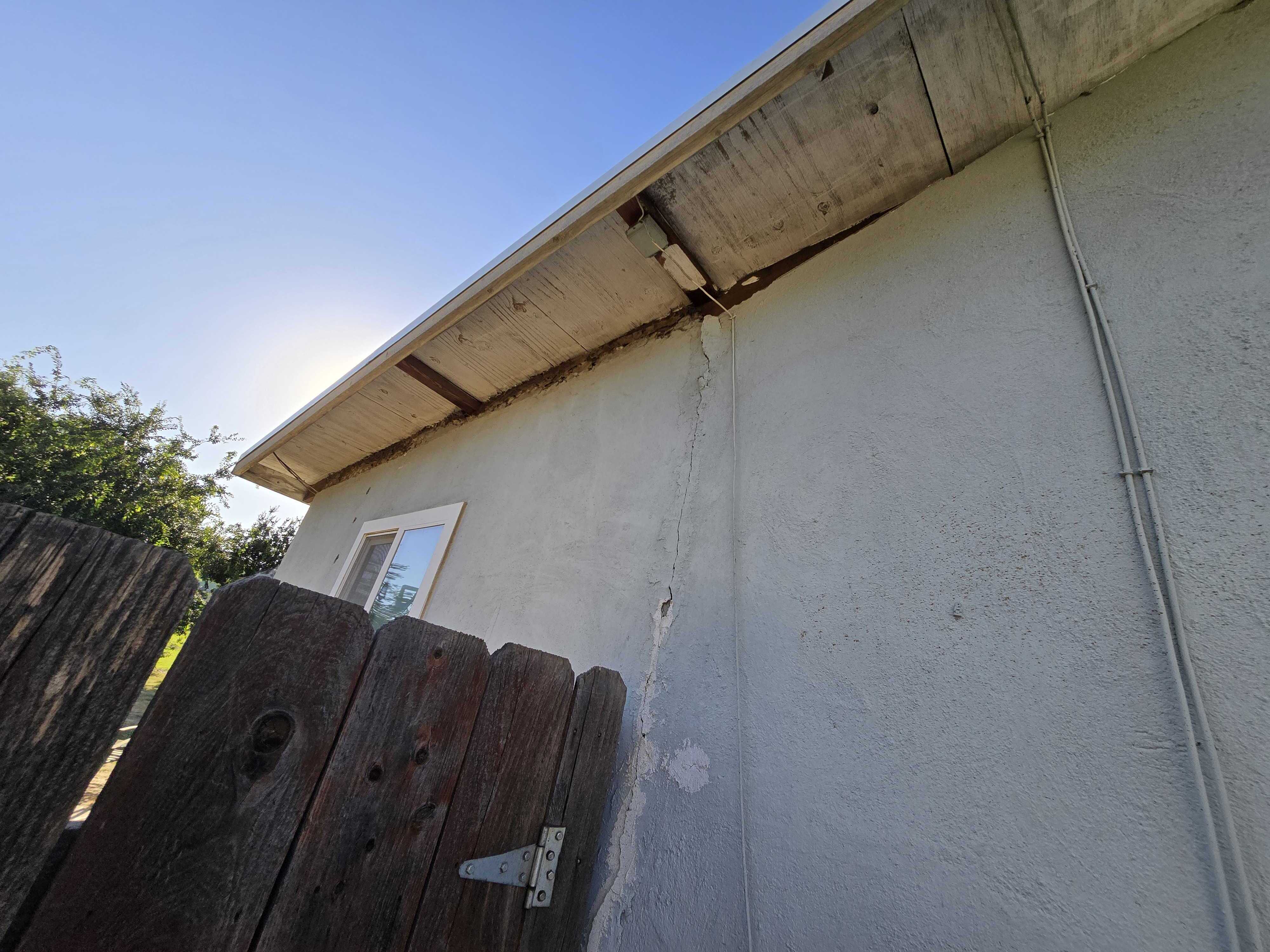 Exterior opening exposed to inspect concealed framing