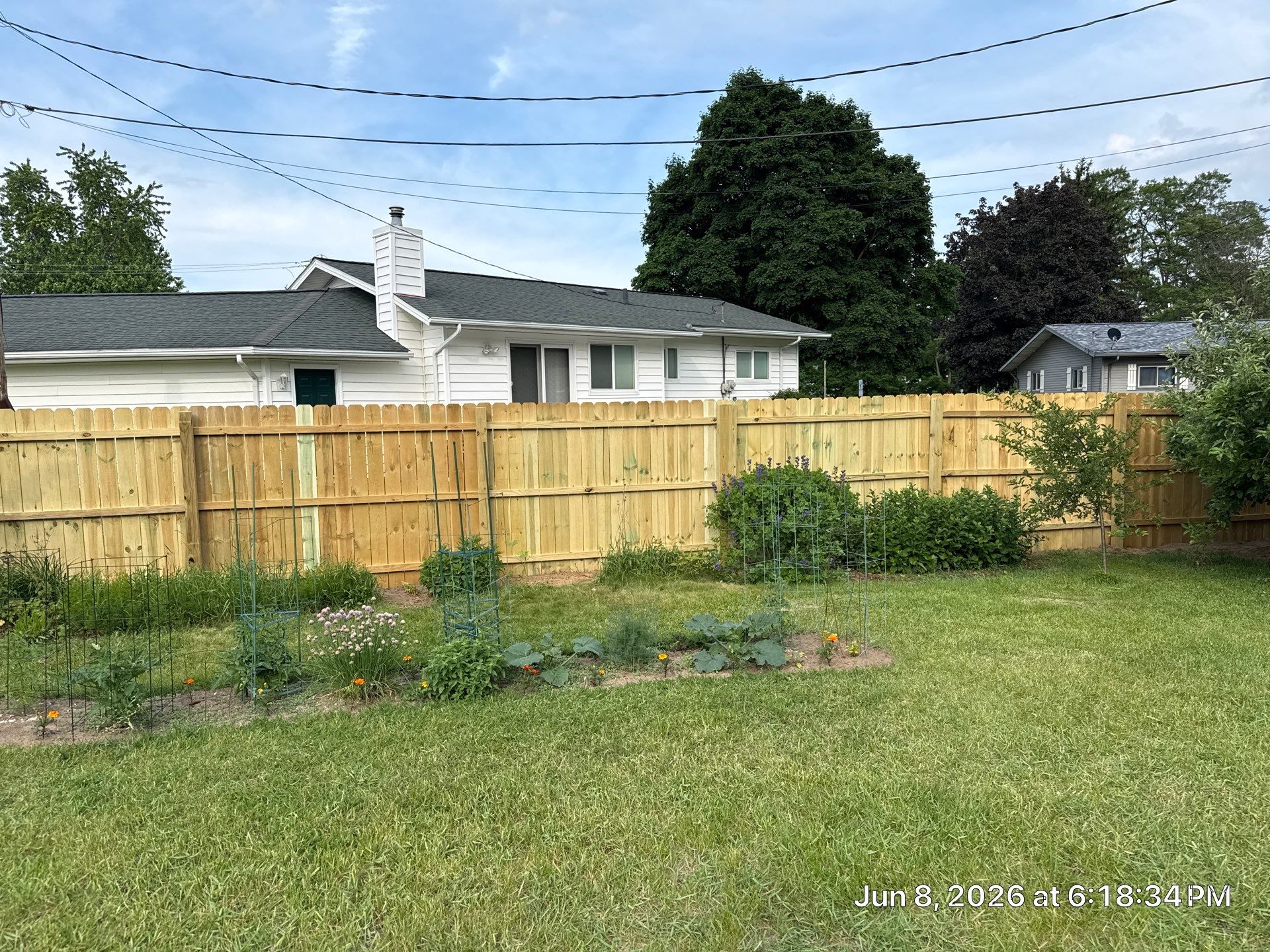 Completed wood fence section after exterior repair work