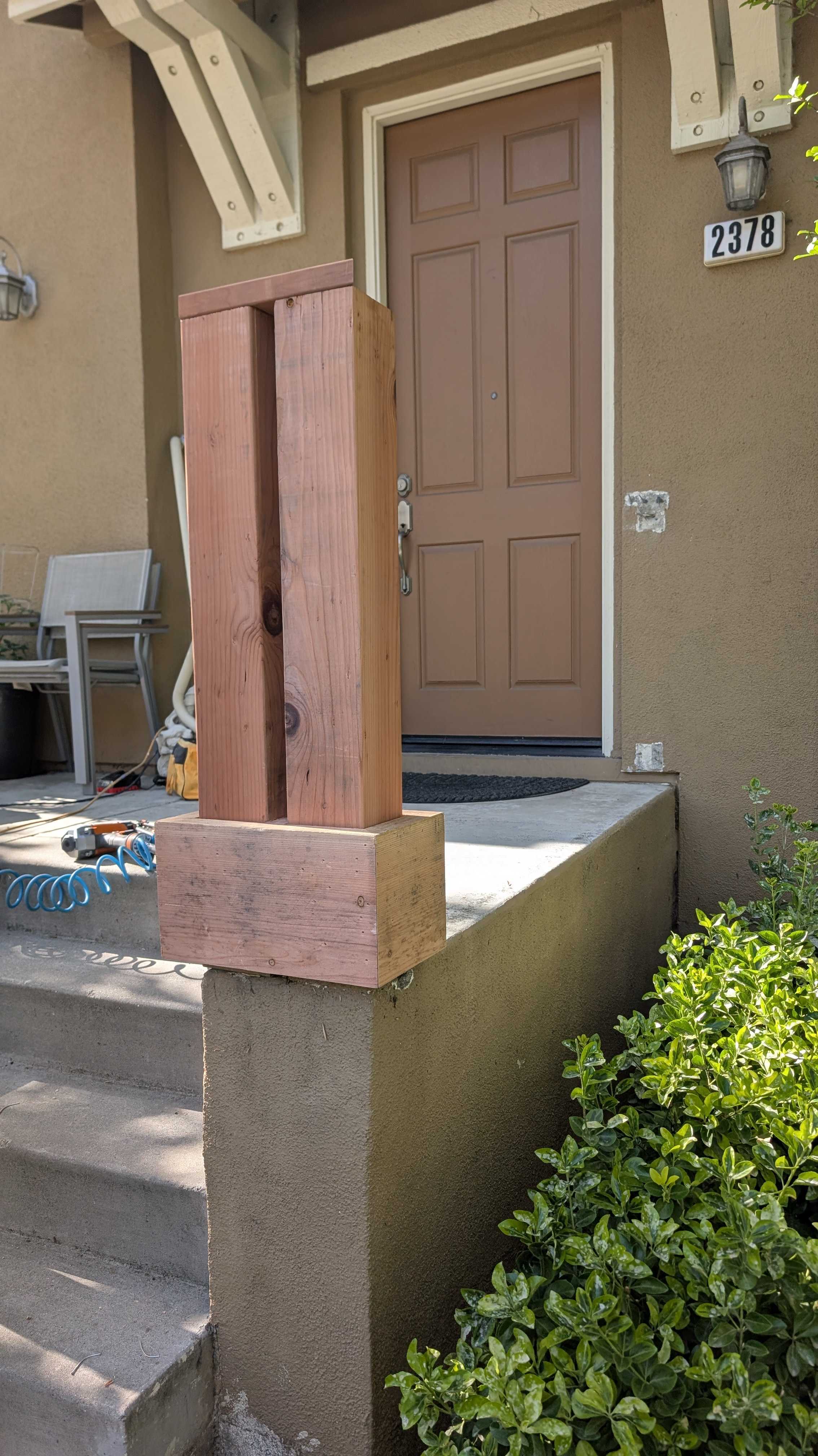 Completed exterior railing replacement beside a residential stair