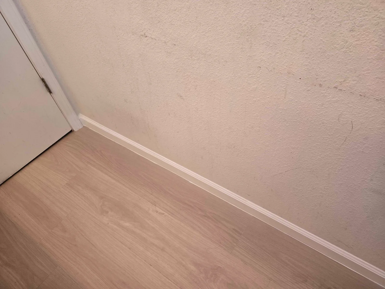 Finished bathroom floor and baseboard