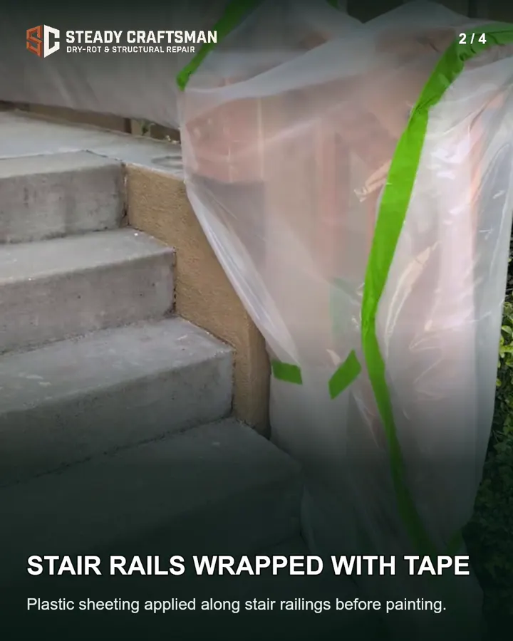 Porch stair railing covered with plastic and tape before painting